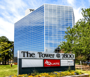 A Sign In Front Of A Building