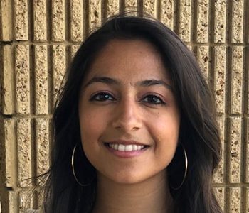 A Woman Smiling For The Camera