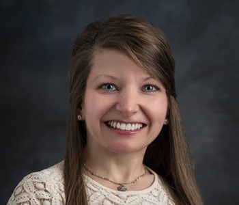 A Woman Smiling For The Camera