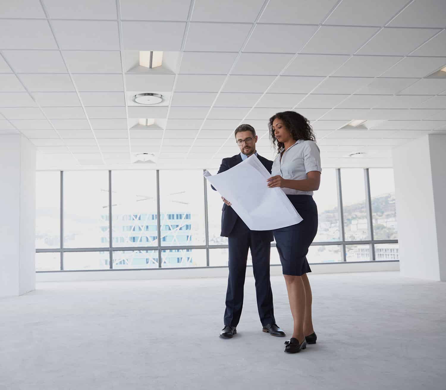 a man and a woman standing in a room