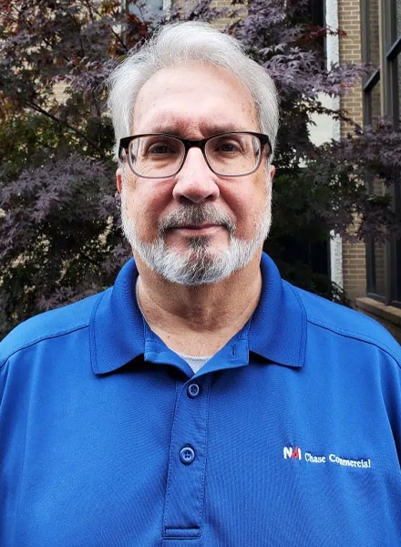 a man wearing glasses and a blue shirt BRAD-ROSENOW