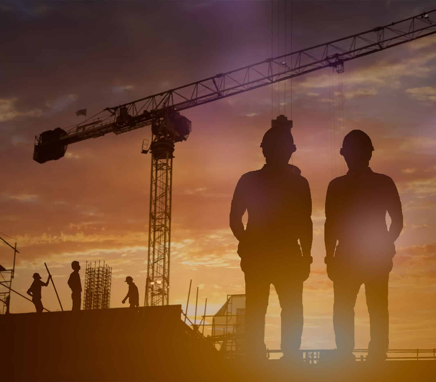 a crane standing in front of a sunset, two workers look at the crane