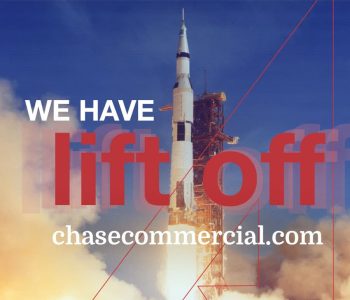 An NAI Chase Commercial Poster Featuring A Rocket Ship Launch Overlayed By Text Saying "We Have Lift Off, Chasecommercial.com"