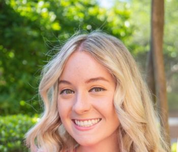 A Woman Smiling For The Camera