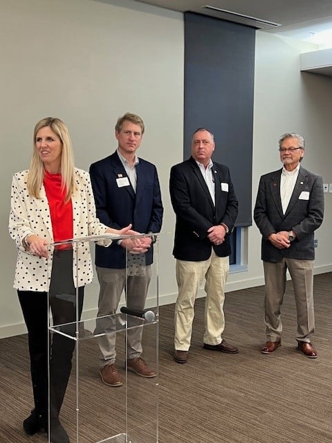A Group Of People Posing For The Camera